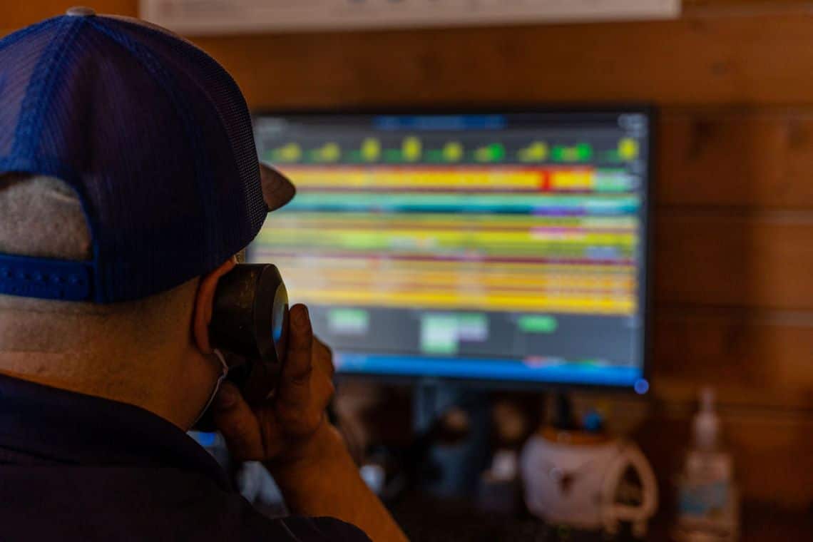 Dispatcher talking on the phone looking at a computer screen