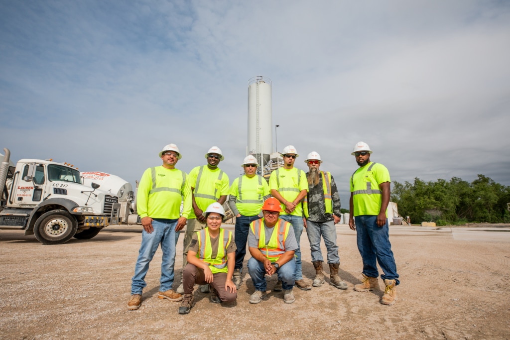 Group of ready mix drivers in front of a plant